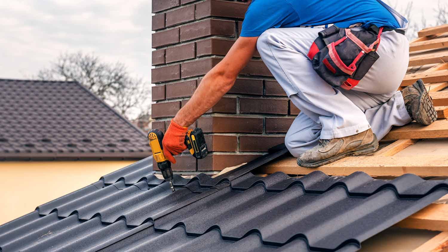 man using tool to repair roof