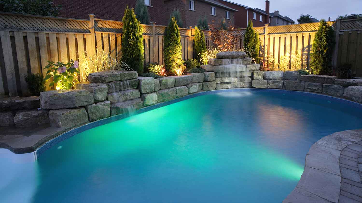 Backyard pool with lighting design