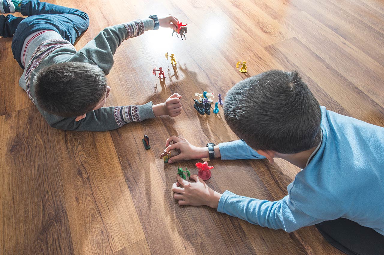 Kids playing with toys on floor