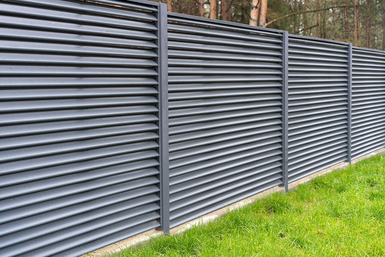 tall metal privacy fence around property