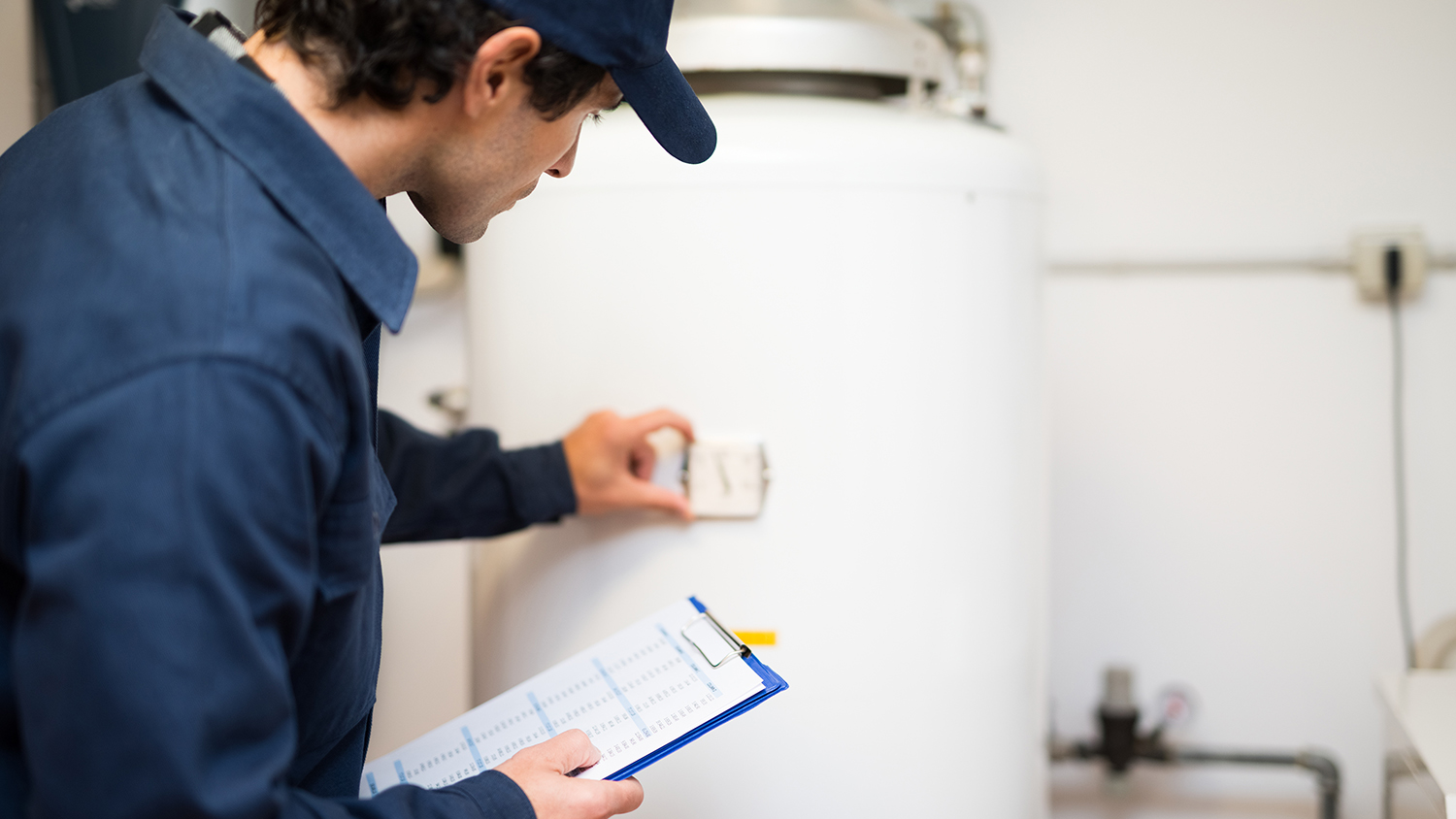 plumber repairing hot water heater