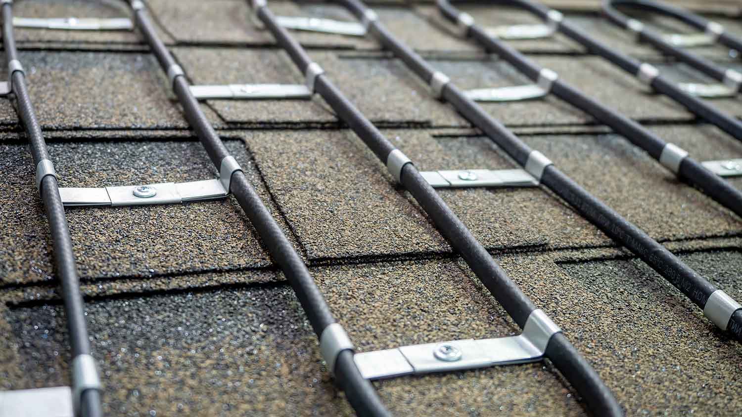 Heating wires installed on the roof of a house